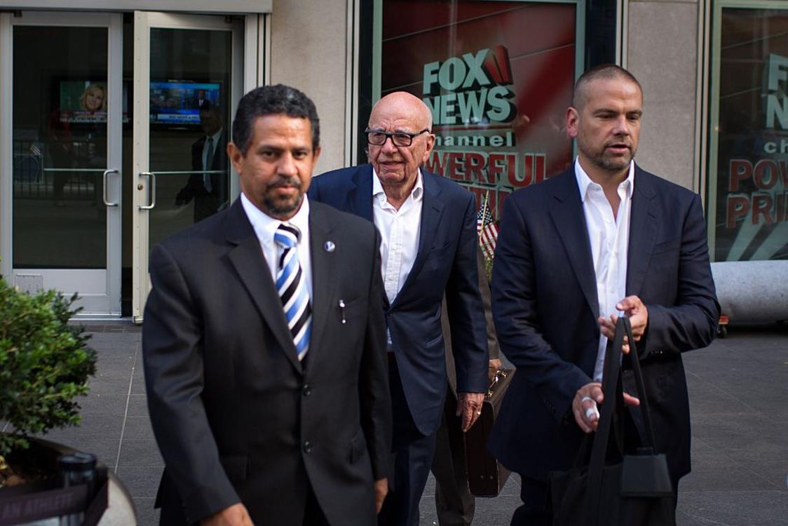 Rupert Murdoch leaves the News Corporation building with son Lachlan