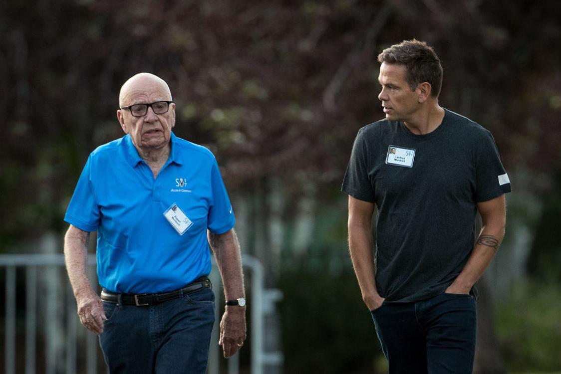 Rupert Murdoch attends a meeting with his son Lachlan