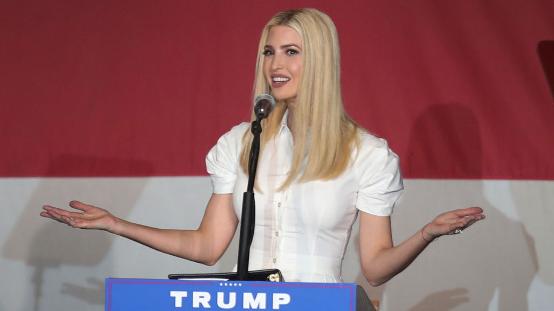 Ivanka Trump standing behind a podium labeled "TRUMP."