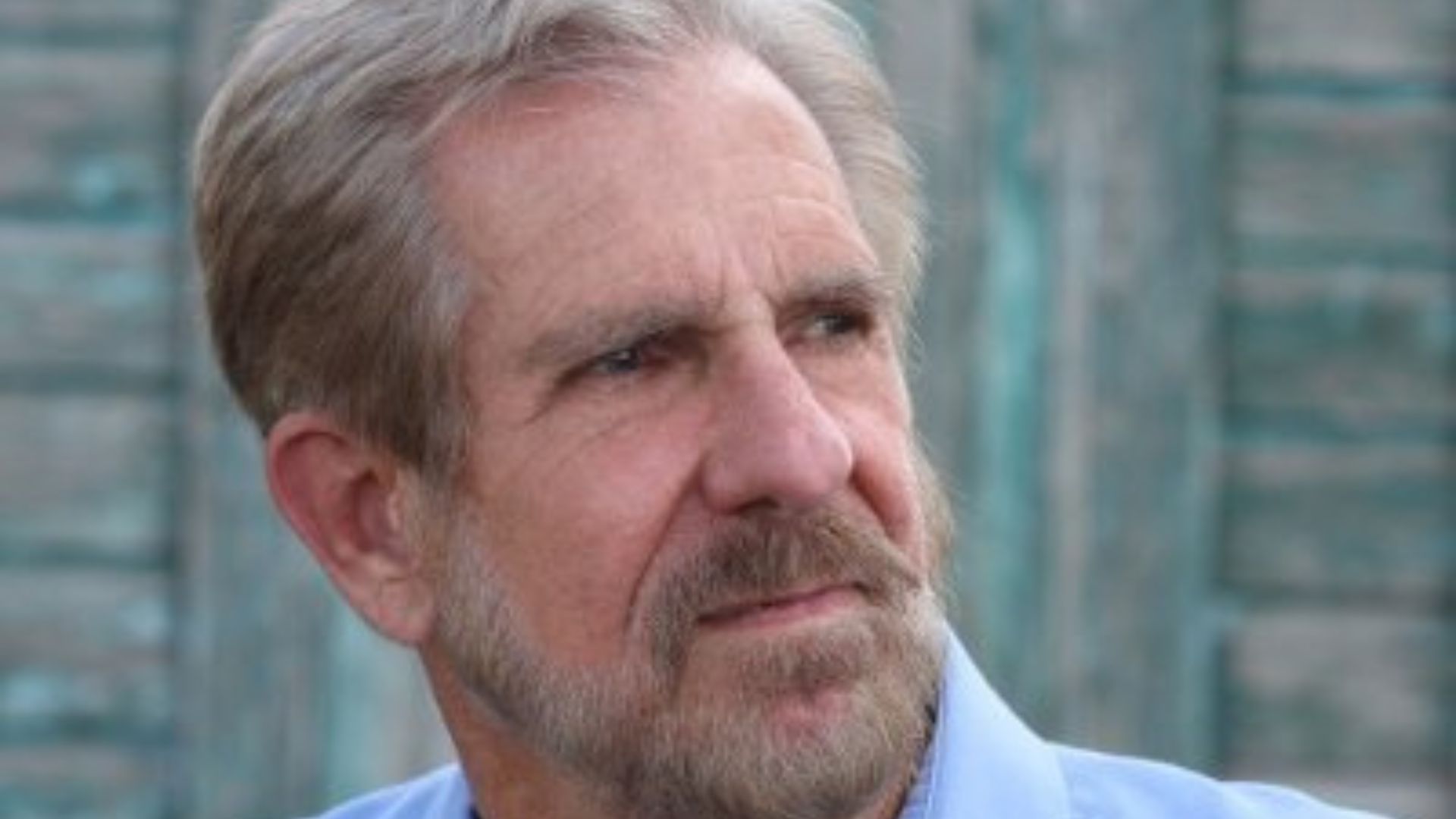 A close-up image of Kenn Kaufman, a renowned naturalist and author