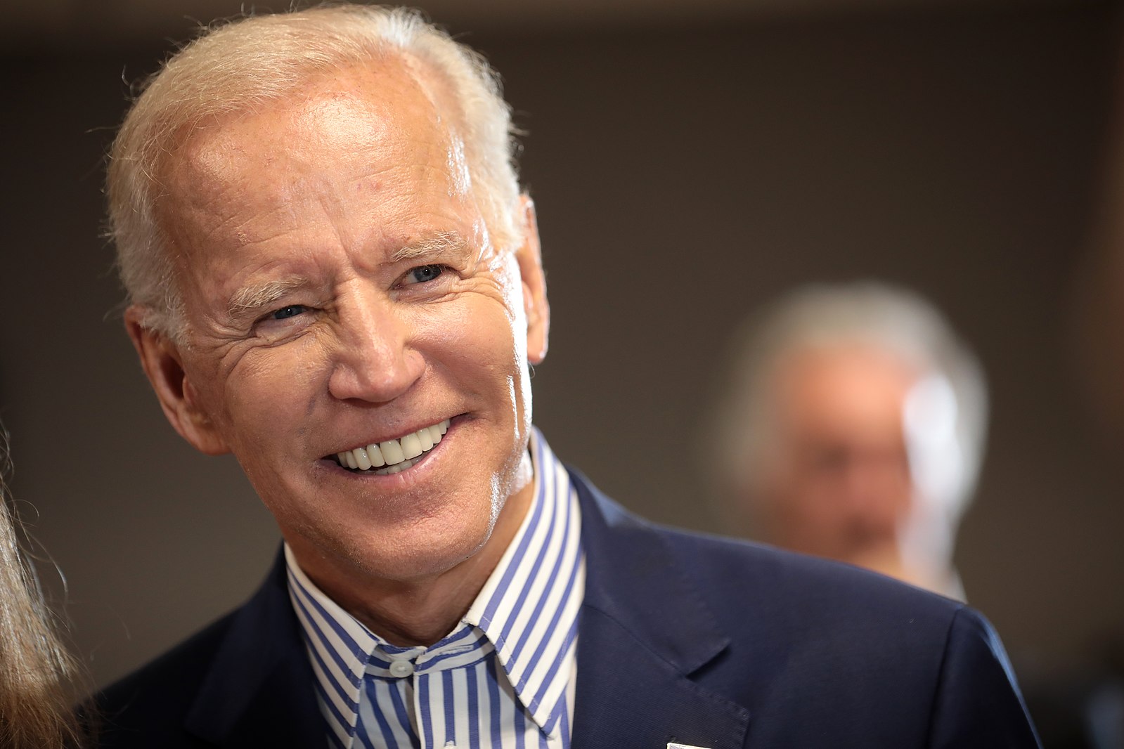 Joe Biden speaking with supporters at a town hall hosted by the Iowa Asian and Latino Coalition at Plumbers and Steamfitters Local 33 in Des Moines, Iowa.